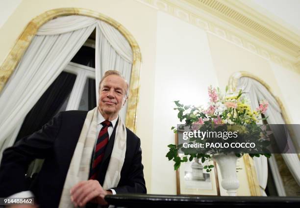 Italian film director Franco Zeffirelli poses at the British Embassy in Rome before receiving the medal of knighthood from the British ambassador to...