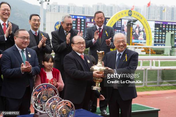 Sir Chow Chung-kong, Steward of the HKJC, presents the Centenary Vase trophy to Dinozzo’s Owner Siu Pak Kwan at Sha Tin racecourse on February 4,...