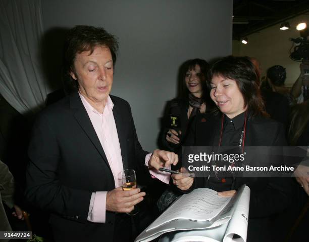 Paul McCartney signs autographs backstage after the Stella McCartney Pret a Porter show as part of the Paris Womenswear Fashion Week Spring/Summer...