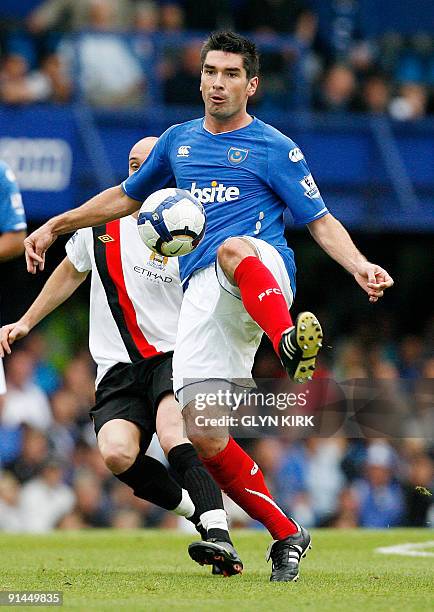 Portsmouth's Scottish Midfielder Richard Hughes in action during their English Premier League football match against Manchester City at Fratton Park...