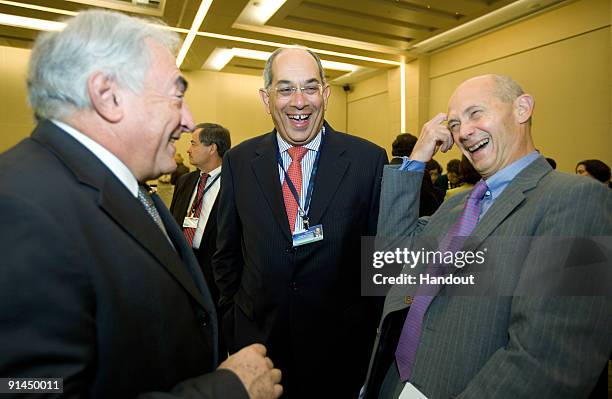 In this handout image supplied by the IMF, International Monetary Fund's Managing Director Dominique Strauss-Kahn shares a laugh with Egyptian...