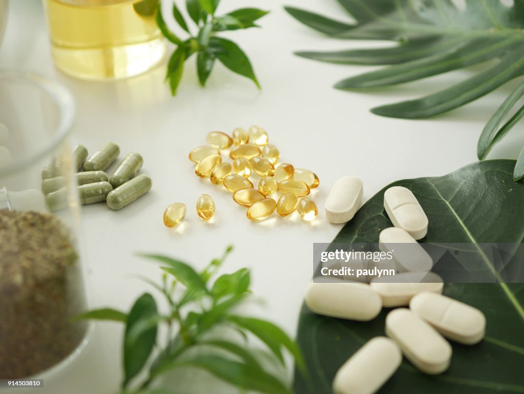Alternative herb medicine. herbal vitamin on white background.