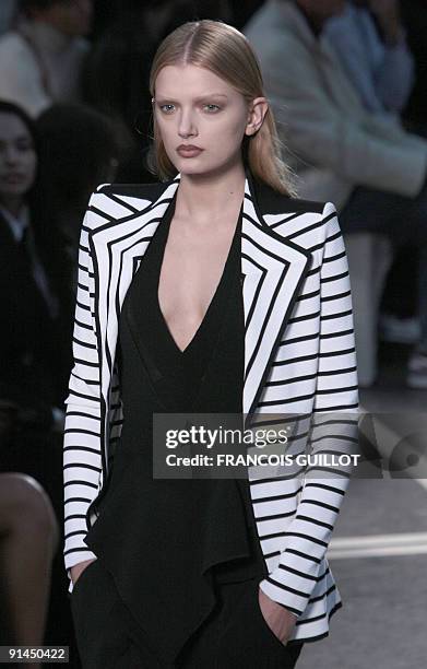 Model presents an outfit by Italian designer Riccardo Tisci for Givenchy during ready-to-wear Spring-Summer 2010 fashion show on October 4, 2009 in...