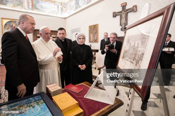 Pope Francis exchanges gifts with President of Turkey Recep Tayyip Erdogan and wife Ermine Erdogan during an audience at the Apostolic Palace on...