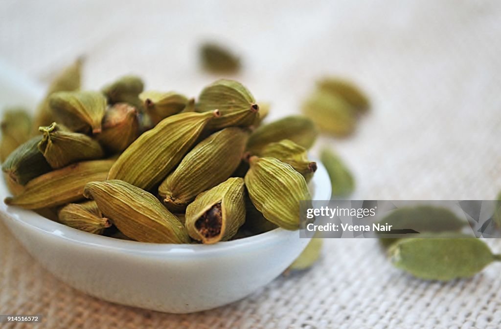Close-up of cardamom/spice in a ceramic spoon
