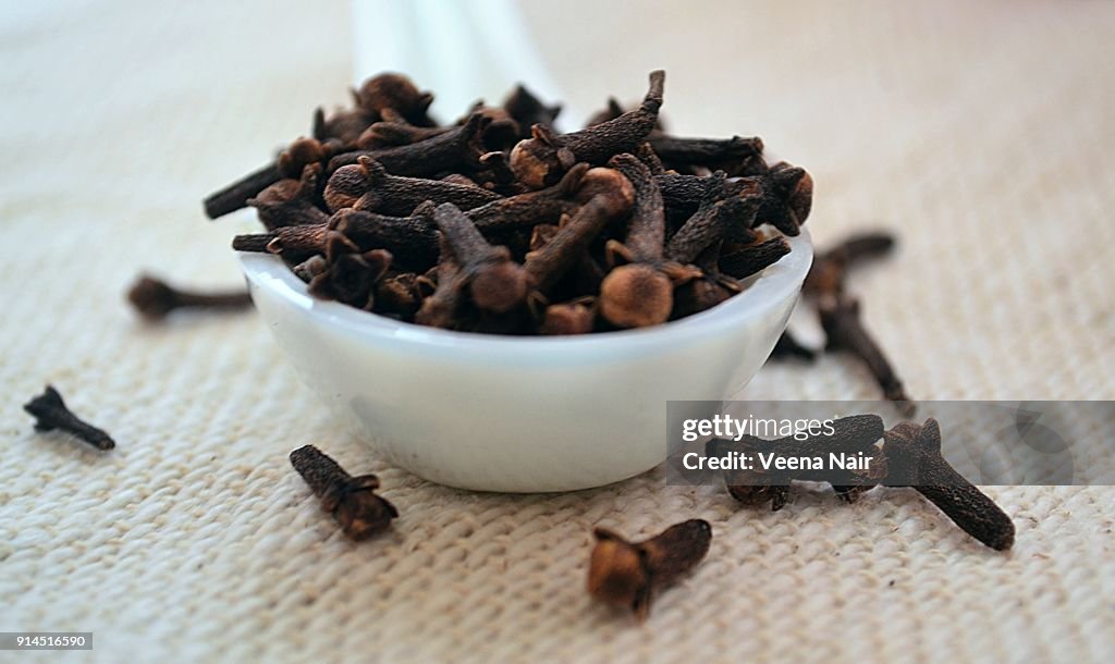 Close-up of clove/spice in a ceramic spoon