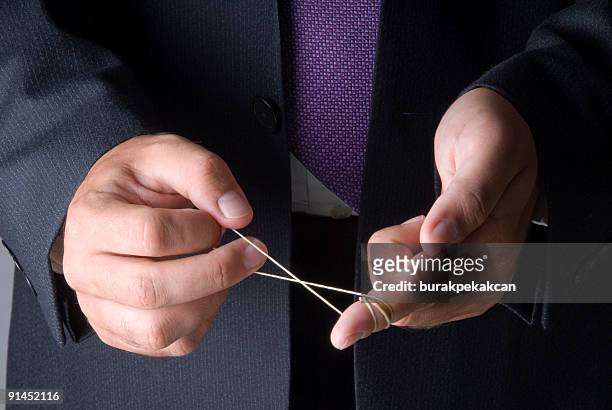 businessman playing with rubber in his hand, istanbul, turkey - human finger stock pictures, royalty-free photos & images