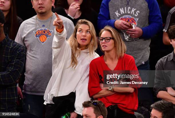 Jessica Hart and guest attend the New York Knicks vs Atlanta Hawks game at Madison Square Garden on February 4, 2018 in New York City.