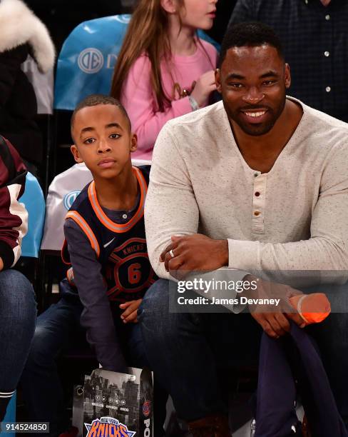 Jayce Tuck and Justin Tuck attend the New York Knicks vs Atlanta Hawks game at Madison Square Garden on February 4, 2018 in New York City.