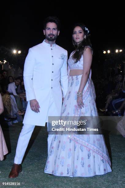 Indian Bollywood actor Shahid Kapoor with his wife Mira Rajput showcase a creation by designer Anita Dongre at the Lakmé Fashion Week Summer Resort...