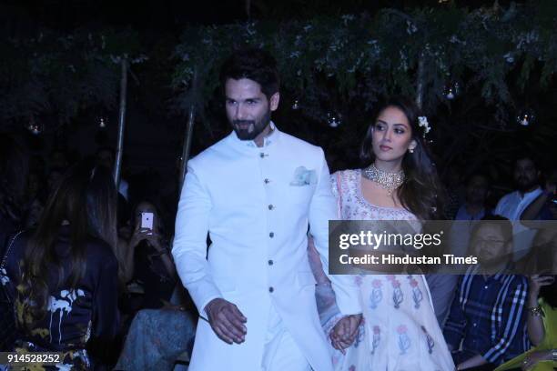 Indian Bollywood actor Shahid Kapoor with his wife Mira Rajput showcase a creation by designer Anita Dongre at the Lakmé Fashion Week Summer Resort...