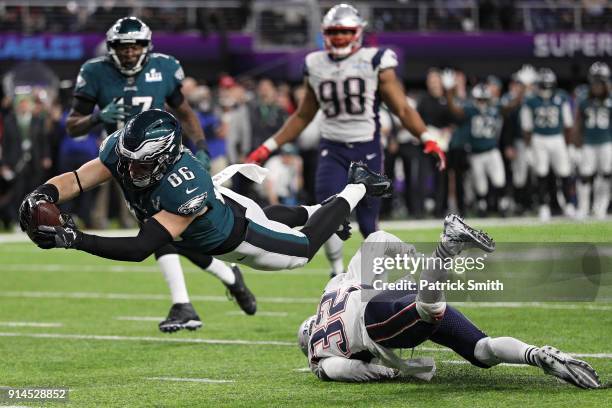 Zach Ertz of the Philadelphia Eagles scores an 11-yard fourth quarter touchdown past Devin McCourty of the New England Patriots in Super Bowl LII at...