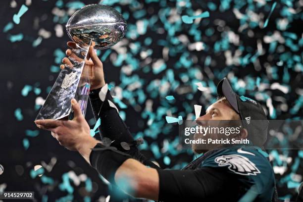 Quarterback Nick Foles of the Philadelphia Eagles raises the Vince Lombardi Trophy after defeating the New England Patriots, 41-33, in Super Bowl LII...