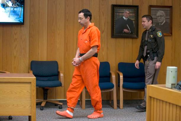 Former Michigan State University and USA Gymnastics doctor Larry Nassar enters the court room for his final sentencing phase in Eaton County Circuit...