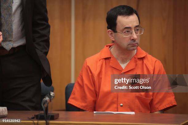 Larry Nassar sits in court listening to statements before being sentenced by Judge Janice Cunningham for three counts of criminal sexual assault in...