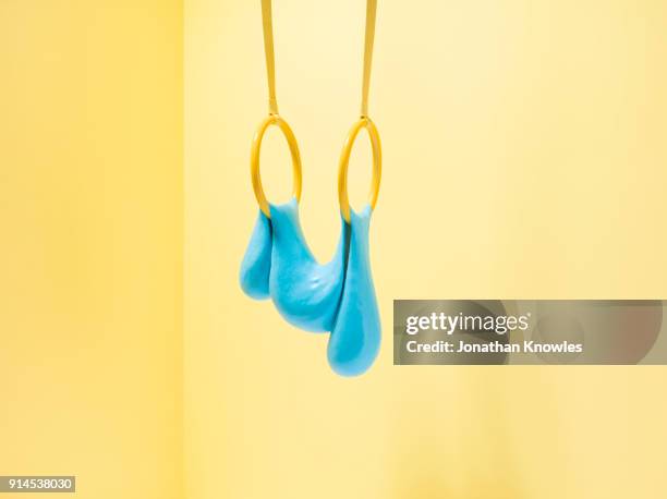 blue slime on gymnastic rings - slime stockfoto's en -beelden