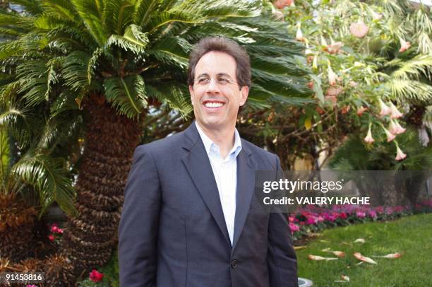 Comedian Jerry Seinfeld poses at a photocall for "The Marriage Ref" a six-episode reality series at the 25th four-day MIPCOM market, on October 05,...