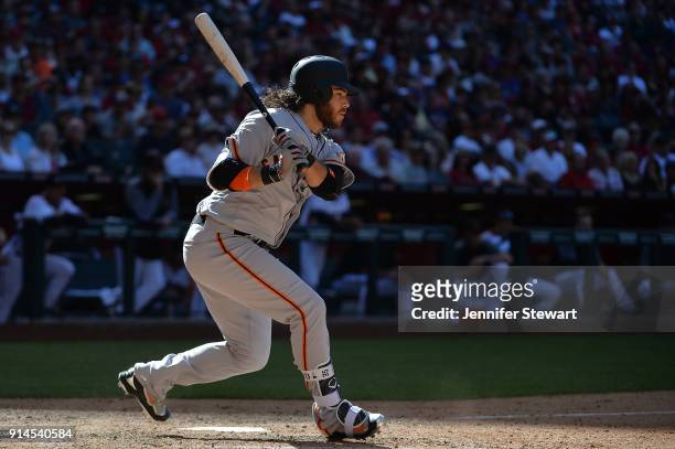 Brandon Crawford of the San Francisco Giants singles to right in the eighth inning against the Arizona Diamondbacks at Chase Field on Sunday, April...