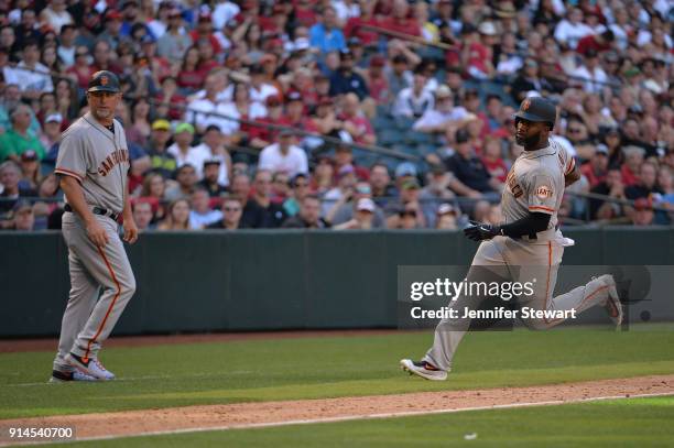 Denard Span of the San Francisco Giants rounds third base in front of third-base coach Phil Nevin in the ninth inning against the Arizona...