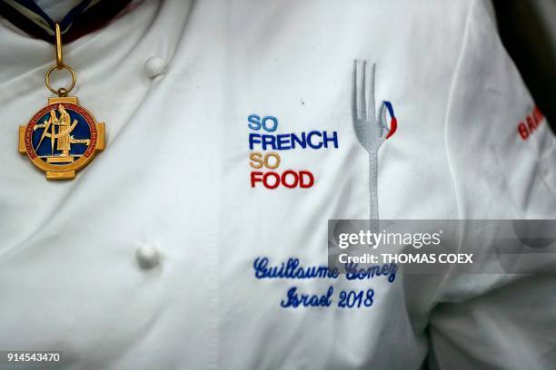 French chef Guillaume Gomez, head chef at France's Elysee palace, answers journalists question during a cooking class for teenage members of an...