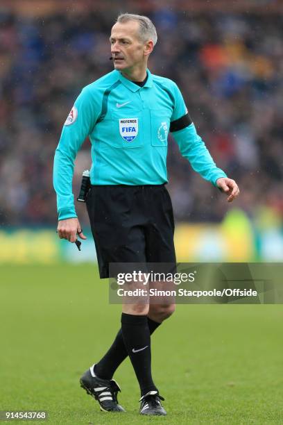 Referee Martin Atkinson looks on during the Premier League match between Burnley and Manchester City at Turf Moor on February 3, 2018 in Burnley,...