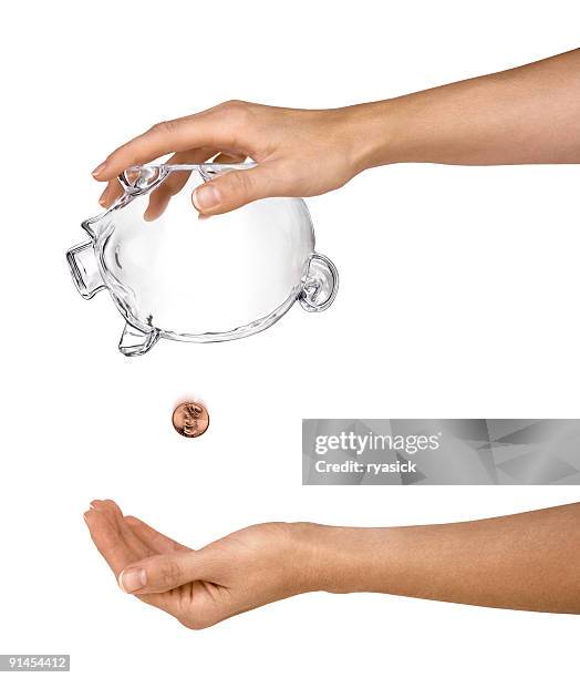 female hands holding empty piggy bank upside-down isolated - disappear stockfoto's en -beelden