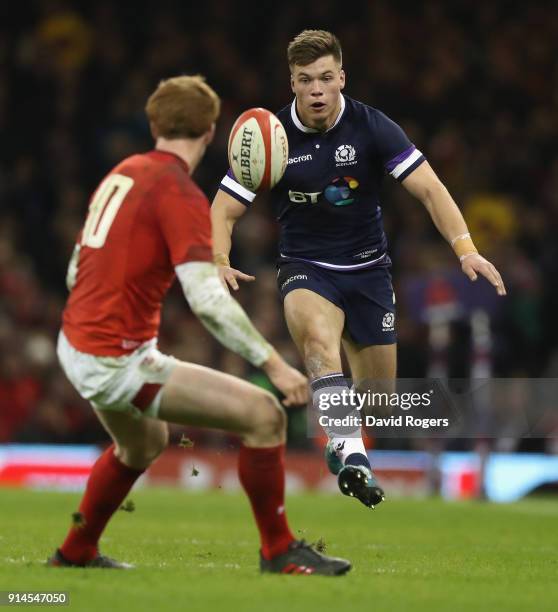 Huw Jones of Scotland kicks the ball upfield during the NatWest Six Nations match between Wales and Scotland at the Principality Stadium on February...