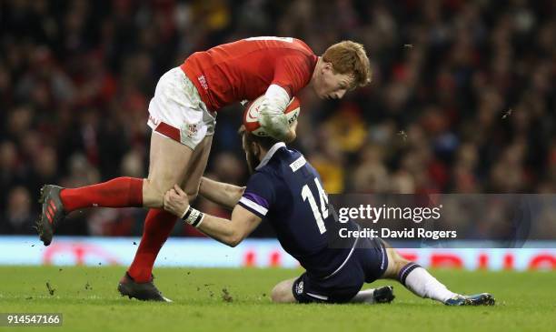 Rhys Patchell of Wales is tackled during the NatWest Six Nations match between Wales and Scotland at the Principality Stadium on February 3, 2018 in...