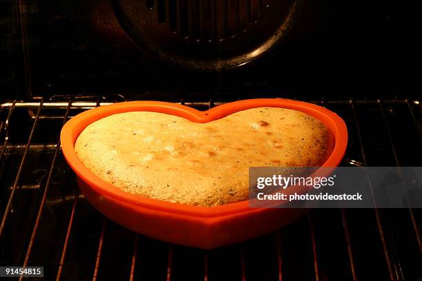 love cake rising in the oven (2) - cake rising stock pictures, royalty-free photos & images