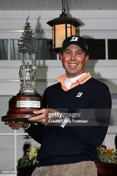 Matt Kuchar holds the trophy aloft following his victory in a 6 hole play-off against Vaughn Taylor at the 2009 Turning Stone Resort Championship at...