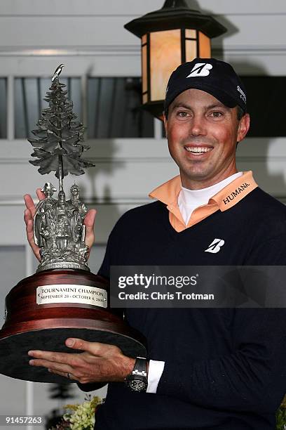 Matt Kuchar holds the trophy aloft following his victory in a 6 hole play-off against Vaughn Taylor at the 2009 Turning Stone Resort Championship at...