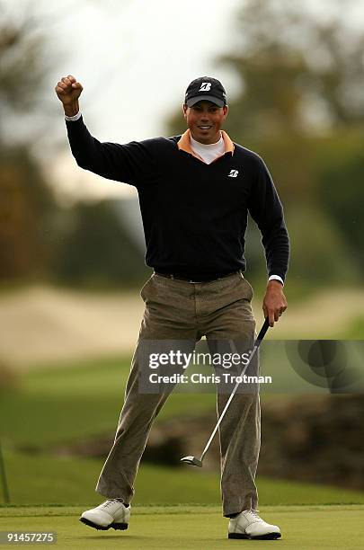 Matt Kuchar celebrates a birdie on the 18th hole during a play-off against Vaughn Taylor at the 2009 Turning Stone Resort Championship at Atunyote...