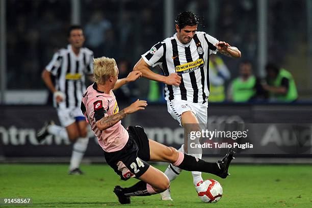 Simon Kjaer of Palermo and Vincenzo Iaquinta of Juventus battle for the ball during the Serie A match played between US Citta di Palermo and Juventus...