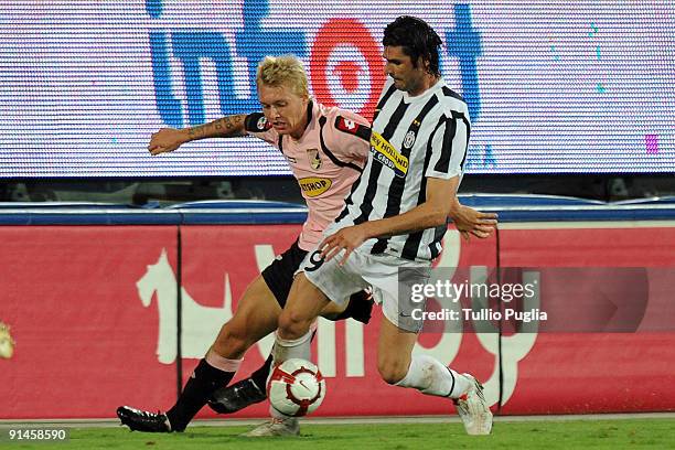 Simon Kjaer of Palermo and Vincenzo Iaquinta of Juventus battle for the ball during the Serie A match played between US Citta di Palermo and Juventus...