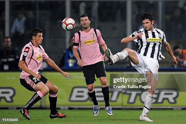 Igor Budan and Cesare Bovo of Palermo and Vincenzo Iaquinta of Juventus compete for the ball during the Serie A match played between US Citta di...