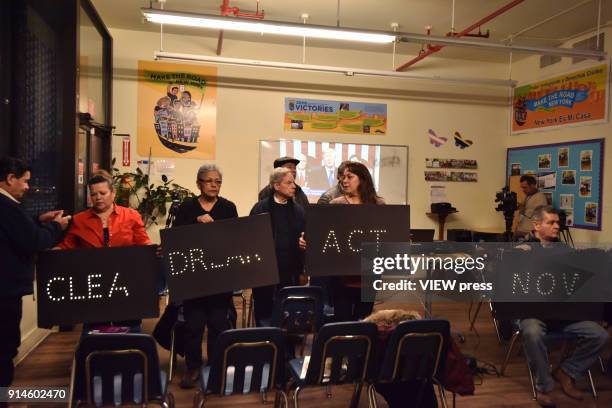 Dreamers, DACA recipients and their supporters turn their backs on U.S President Donald Trump on screen during the State of Union speech at the...