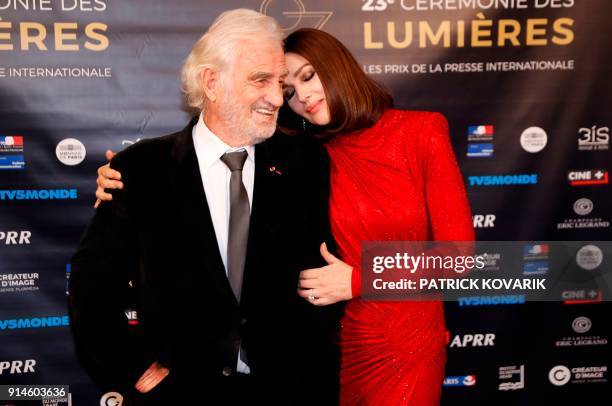 French actor Jean-Paul Belmondo poses with fellow guest of honour Italian actress Monica Bellucci during a photocall prior to attend the 23rd...