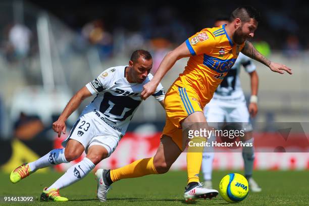 Marcelo Diaz of Pumas struggles for the ball with Andre Pierre Gignac of Tigres during the 5th round match between Pumas UNAM and Tigres UANL as part...