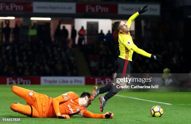 Gerard Deulofeu of Watford is fouled for a penalty kick by Thibaut Courtois of Chelsea during the Premier League match between Watford and Chelsea at...