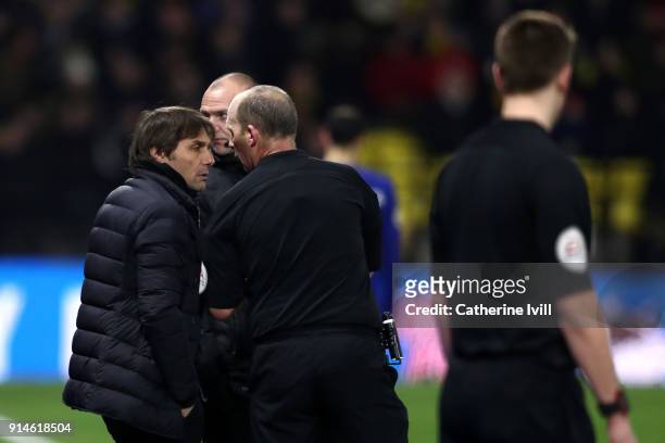 Antonio Conte, Manager of Chelsea speaks to referee, Mike Dean during the Premier League match between Watford and Chelsea at Vicarage Road on...