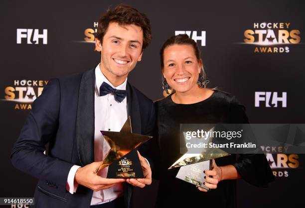 Arthur van Doren of Belgium and Delfina Merino of Argentina hold their awards for player of the year during the Hockey Star Awards night at Stilwerk...