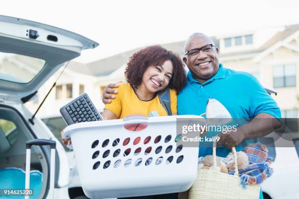 african-american father helping daughter move - father daughter college stock pictures, royalty-free photos & images