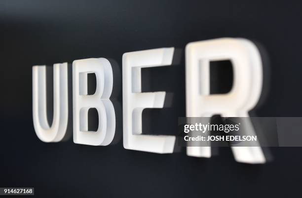 The Uber logo is seen outside the Uber Corporate Headquarters building in San Francisco, California on February 05, 2018. - The billion-dollar trial...
