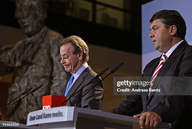 Outgoing Chairman Franz Muentefering of the German Social Democrats and Sigmar Gabriel adress the media during a press conference following a meeting...