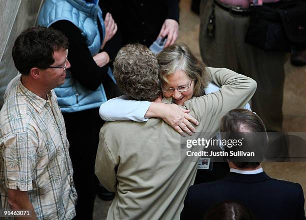 University of California San Francisco scientist Elizabeth Blackburn is greeted by a UCSF colleague after winning the Nobel Prize in Medicine October...