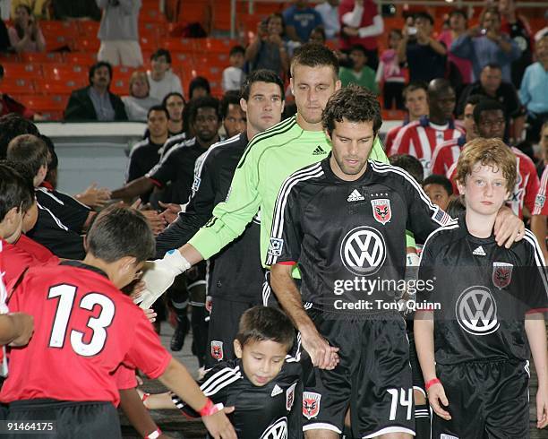 Ben Olsen of D.C. United leads his team onto the field during an MLS match against Chivas USA at RFK Stadium on October 3, 2009 in Washington,...