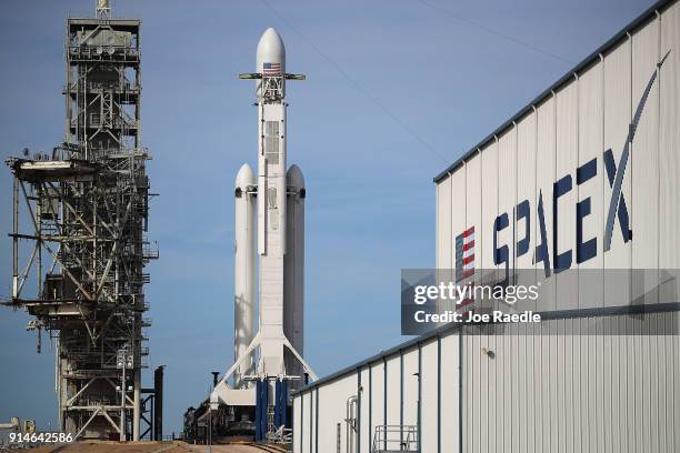 The SpaceX Falcon Heavy rocket sits on launch pad 39A at Kennedy Space Center as it is prepared for tomorrow's lift-off on February 5, 2018 in Cape...