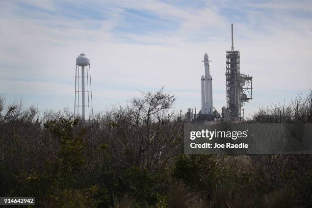 The SpaceX Falcon Heavy rocket sits on launch pad 39A at Kennedy Space Center as it is prepared for tomorrow's lift-off on February 5, 2018 in Cape...