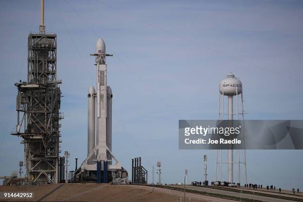 The SpaceX Falcon Heavy rocket sits on launch pad 39A at Kennedy Space Center as it is prepared for tomorrow's lift-off on February 5, 2018 in Cape...