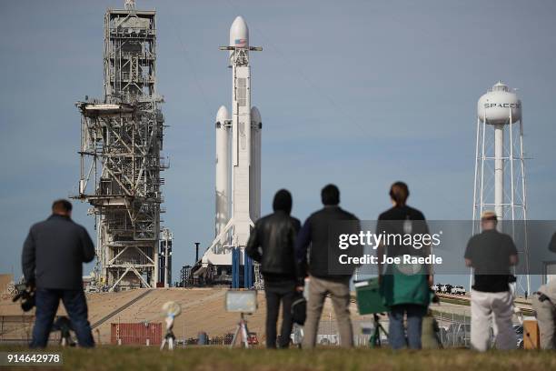 The SpaceX Falcon Heavy rocket sits on launch pad 39A at Kennedy Space Center as it is prepared for tomorrow's lift-off on February 5, 2018 in Cape...